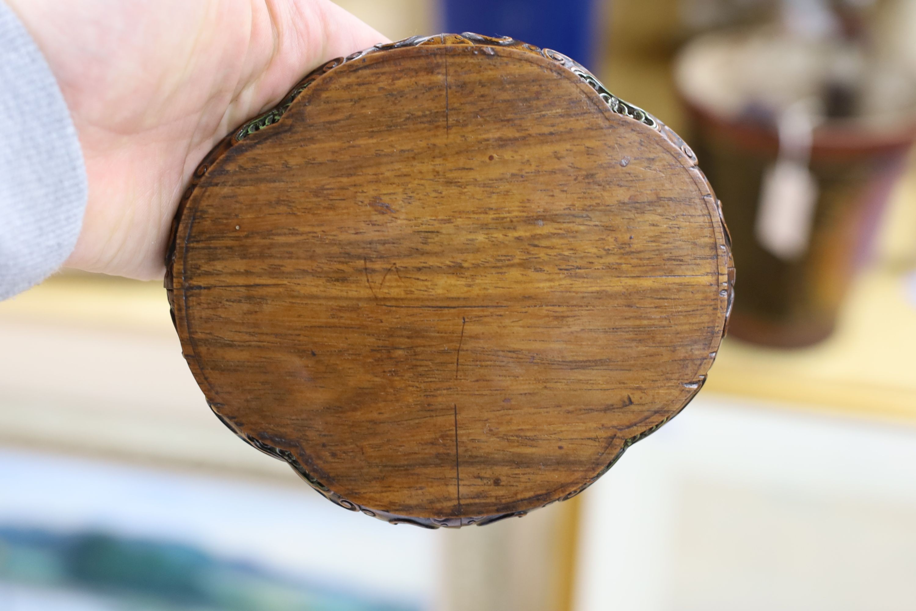 A fine Chinese oval hardwood and green stained Ivory inset stand, Qing dynasty, lacking stretcher, 15 cms wide.